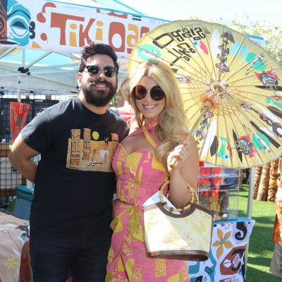 couple in tiki apparel at marketplace event